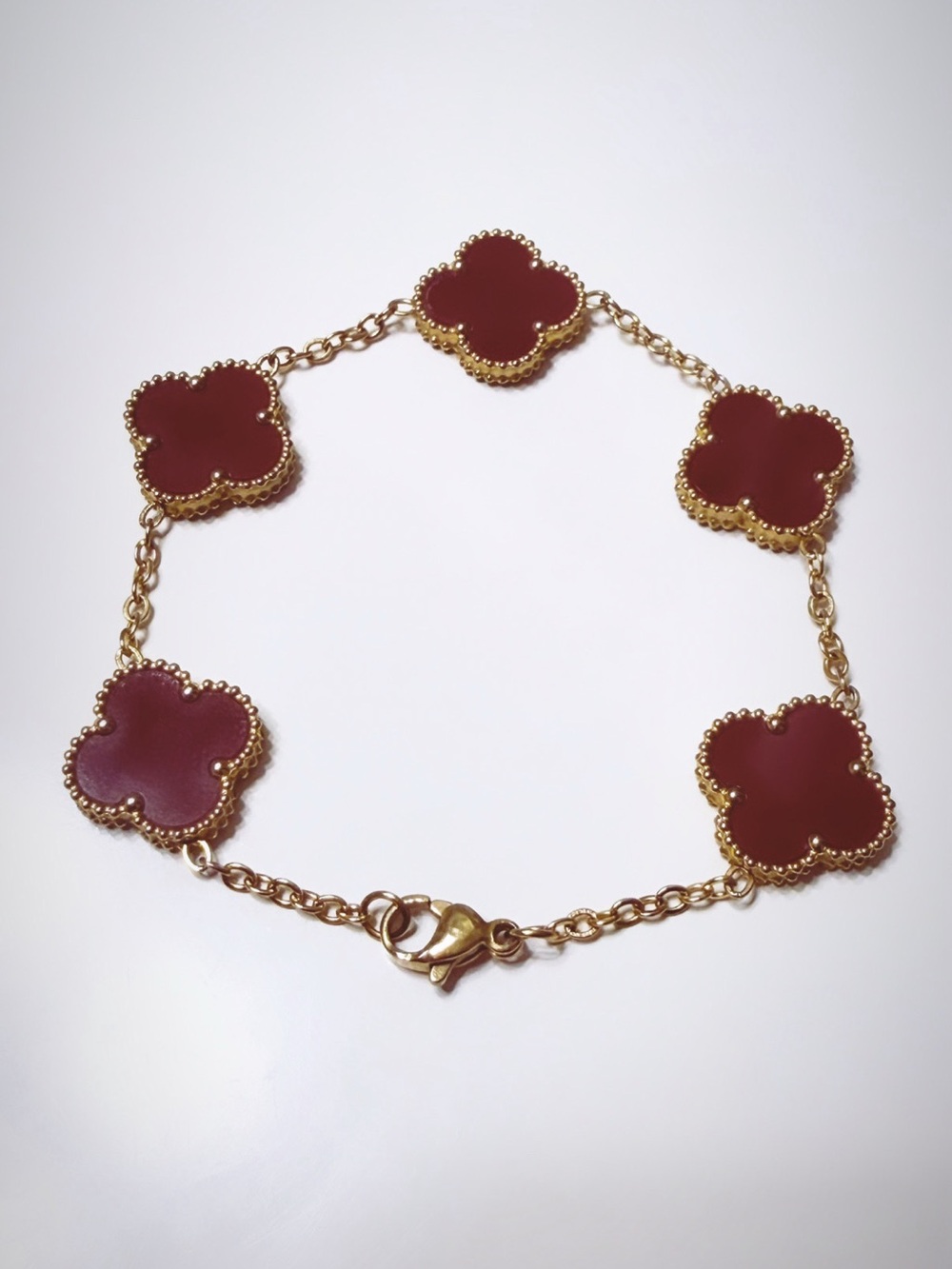 Gold-Tone Bracelet with Burgundy Clover Motifs